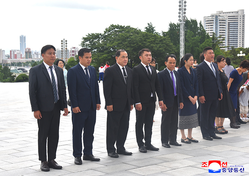 Resident foreign diplomats lay flower baskets at statues of President Kim Il Sung and Chairman Kim Jong Il